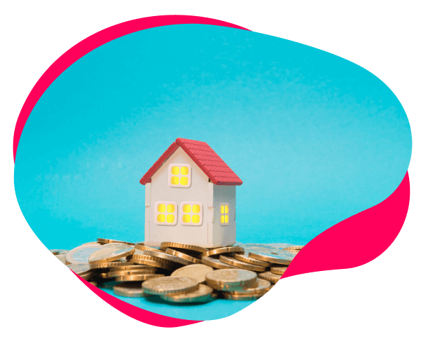 Image of a toy house sitting on coins.