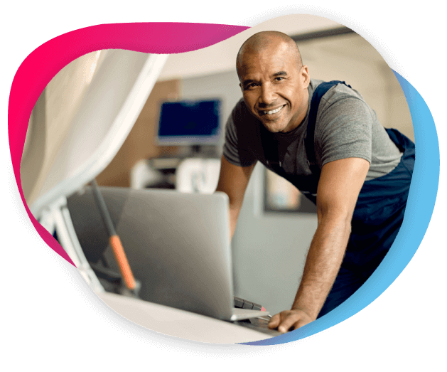 Image of a man using a laptop