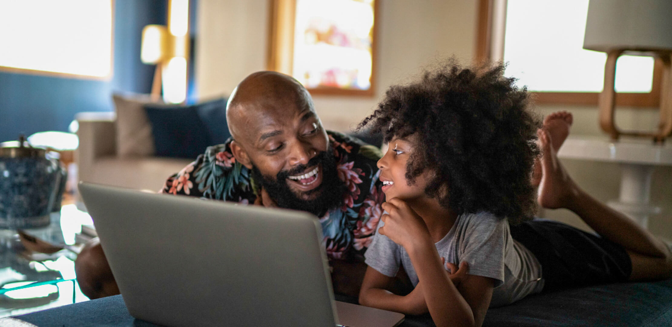 Father and daughter safely and comfortably browsing the Internet.
