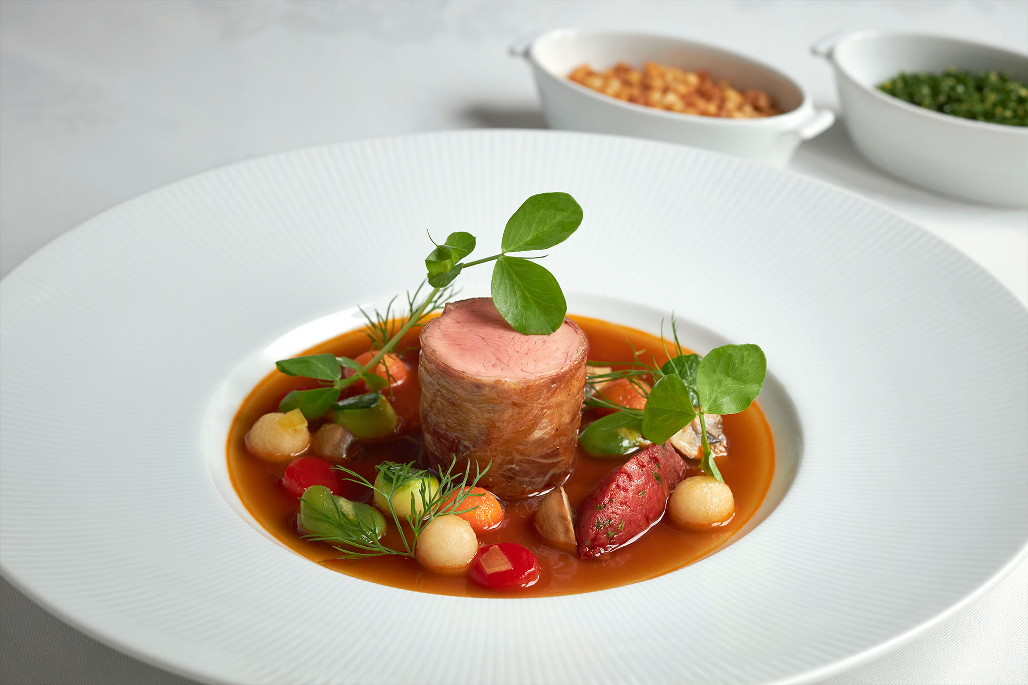 Prosciutto-Wrapped Veal Tenderloin in a Fragrant Broth
Perfumed with Spring Vegetables