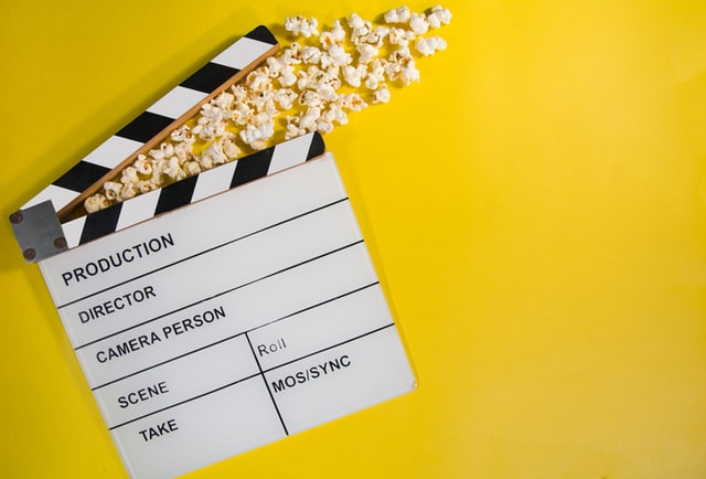 Clapperboard and popcorn