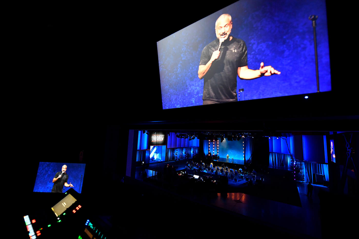 Adam Hunter on a video screen inside the UFC Apex Front of House Booth