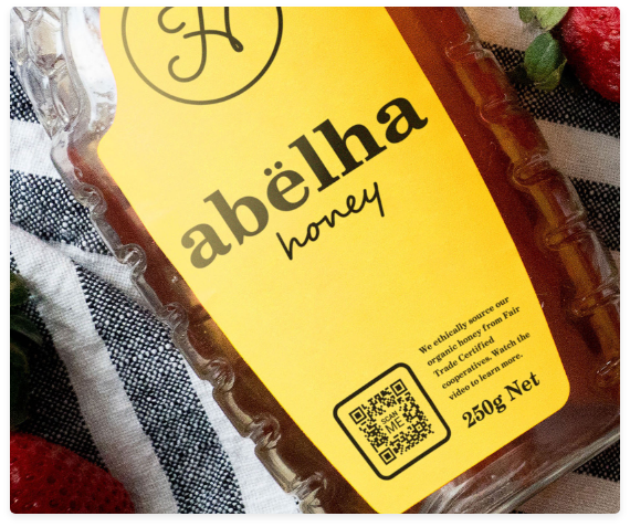 QR code on bottle of honey with clear call to action