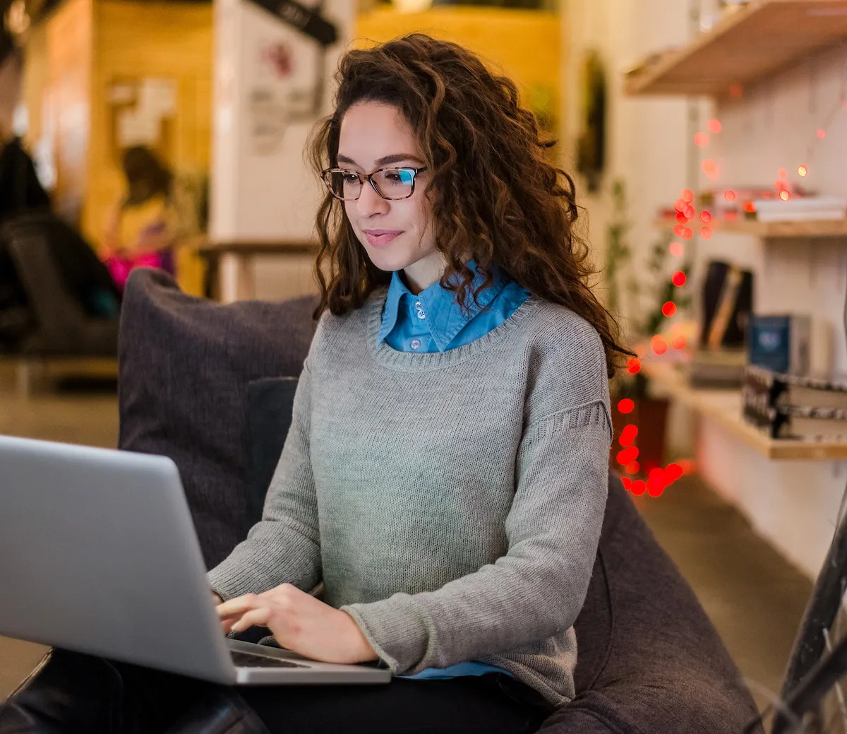 Photo of a woman writing on a computer