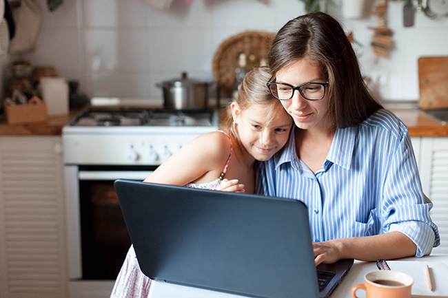 mother and daughter at laptop computer