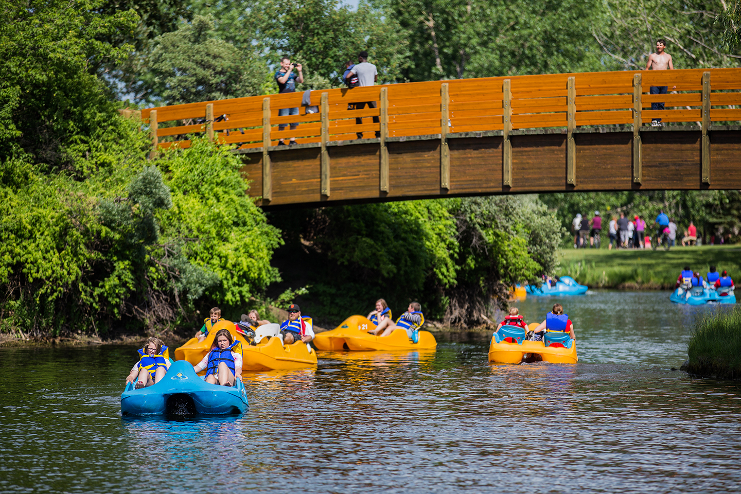 6 multi coloured paddle boats having fun on Bower Ponds 