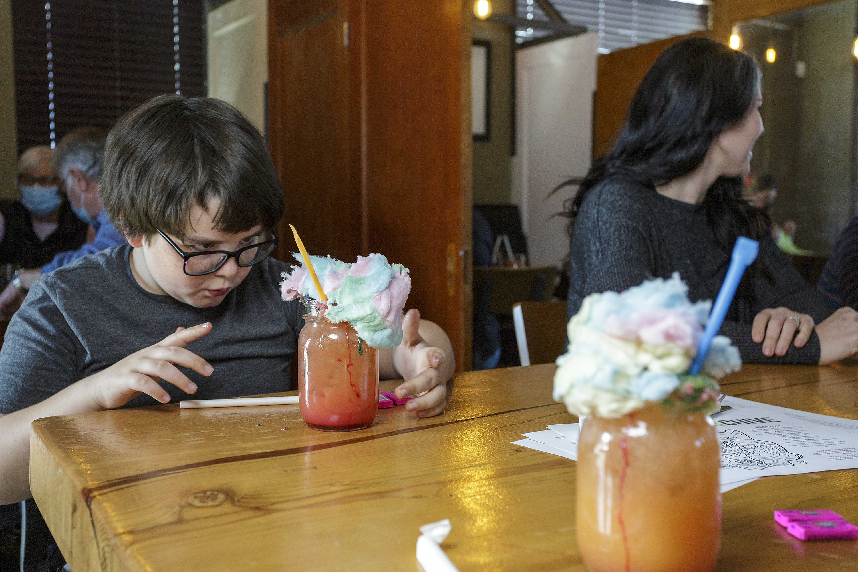 Child enjoying a fun cotton candy drink