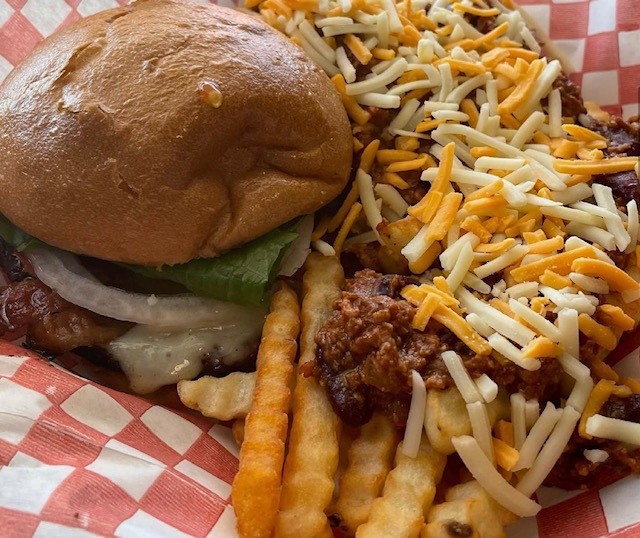 One of L'il Diner 2/42 burger with a side of chili fries