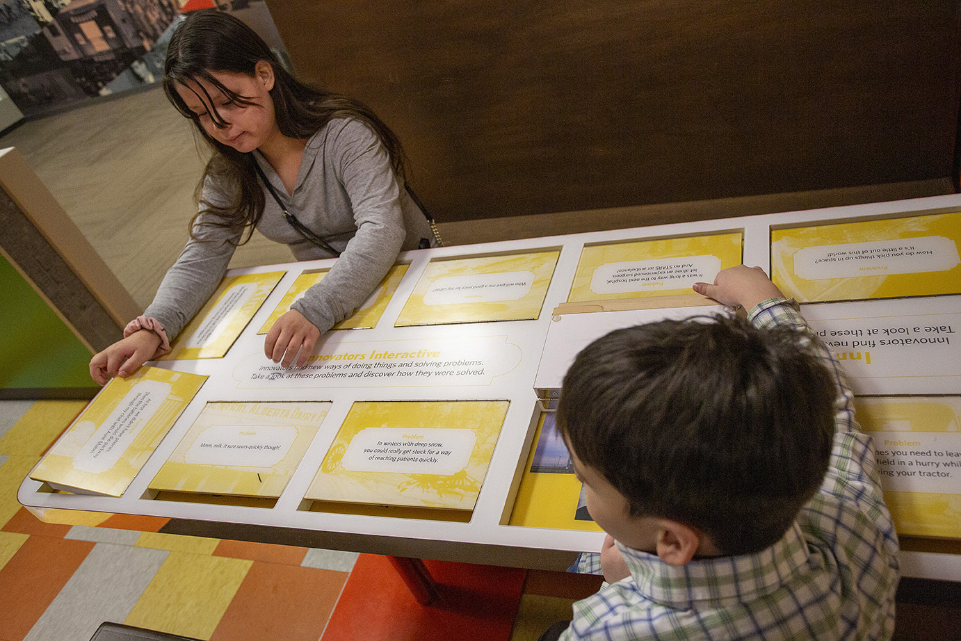 Red Deer Museum & Art Gallery with two children learning with an interactive display