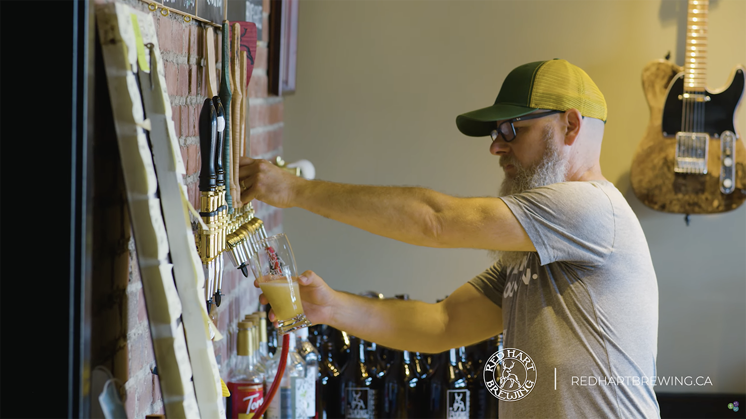 Man tapping beer into glass