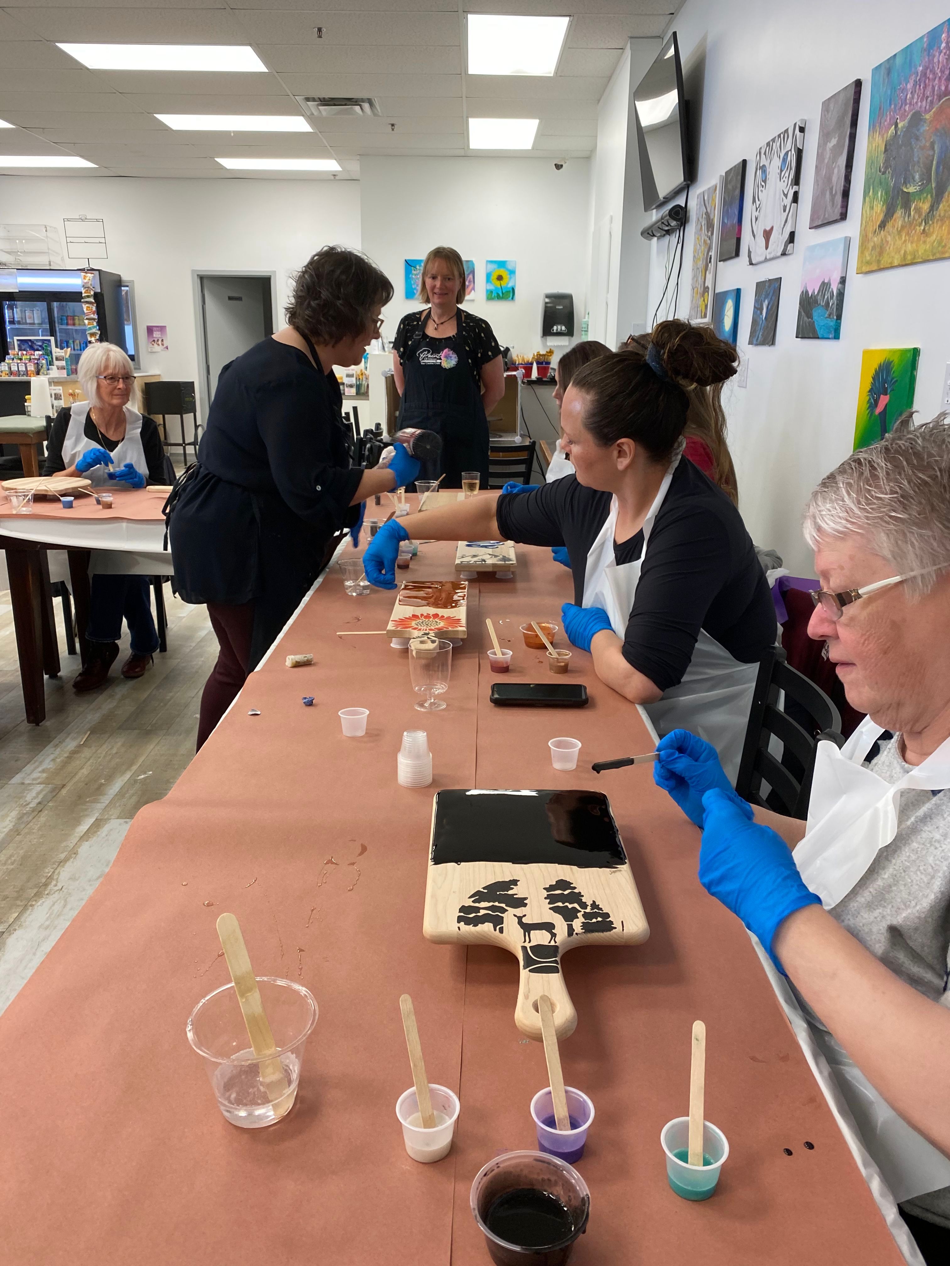 Image of a group of people painting 