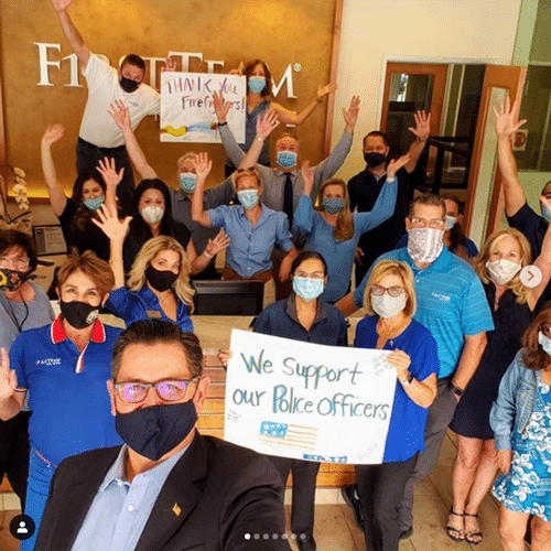 A Grow of realtors with Signs