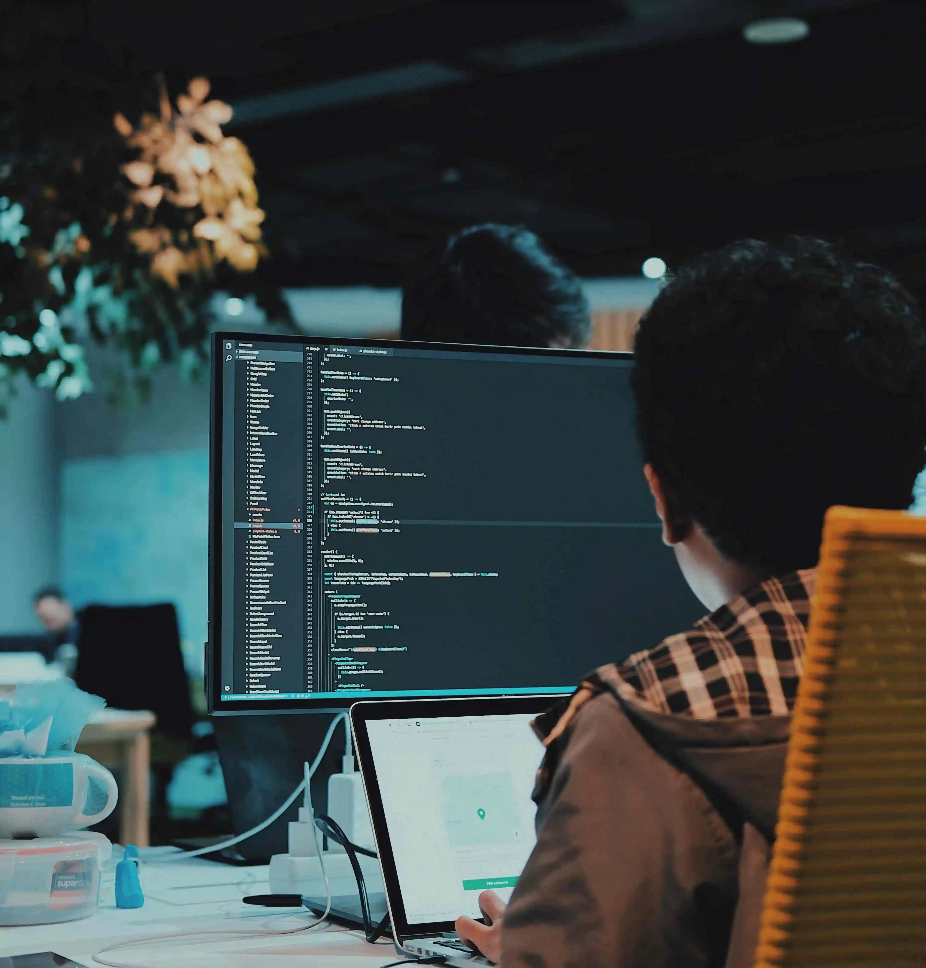person on a computer coding