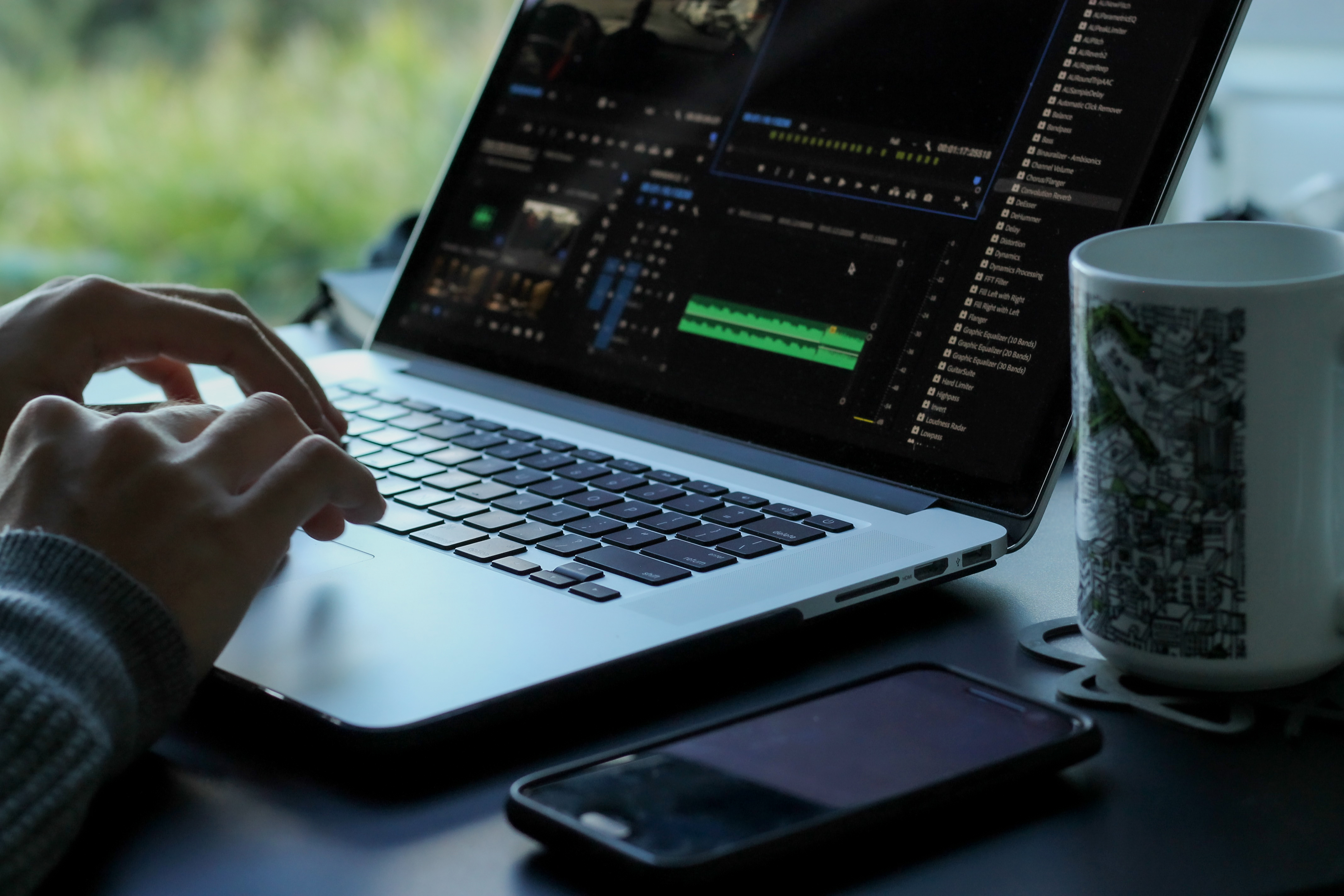 Video editing work from home remotely with travel insurance as digital nomads