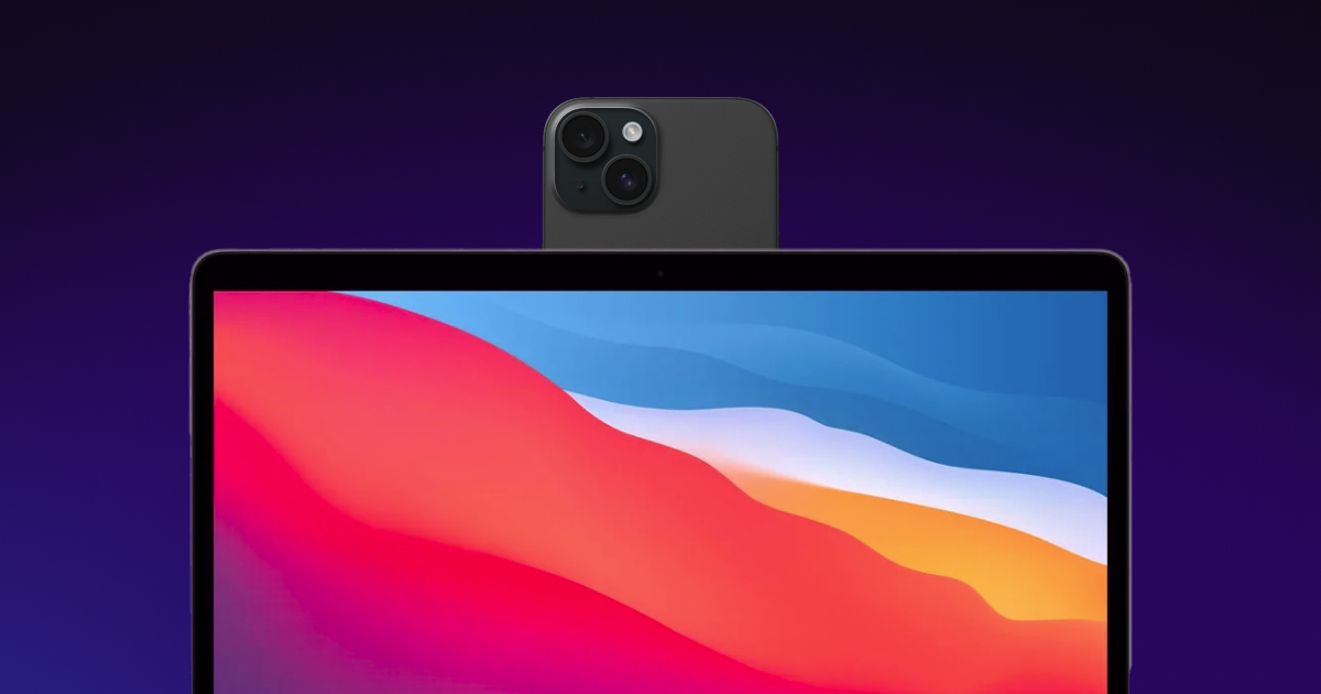 Phone mounted on top of Mac laptop