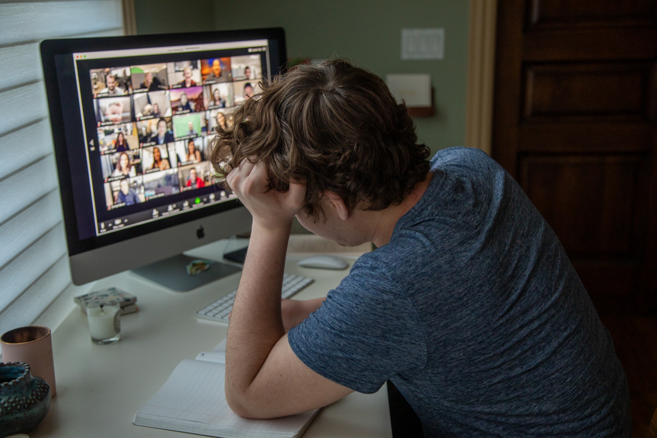 An employee burned out from a virtual meeting