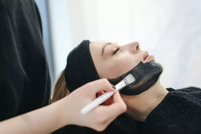 A lady applying face mask