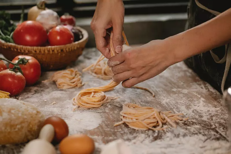 A man making noodles 