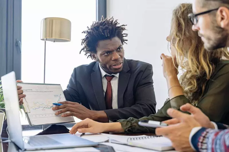 A man showing graph too employes