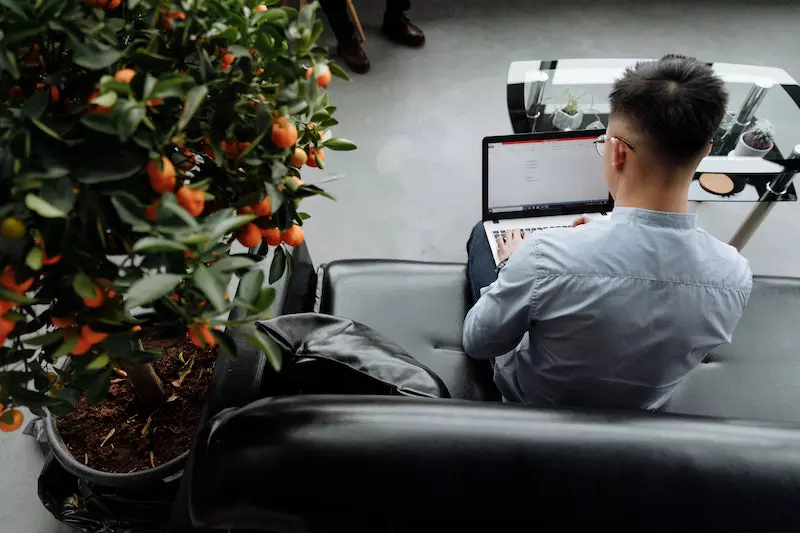 A Man is working in the laptop