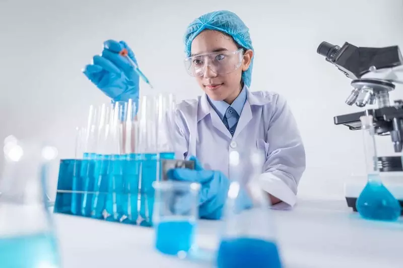 A lady testing chemicals