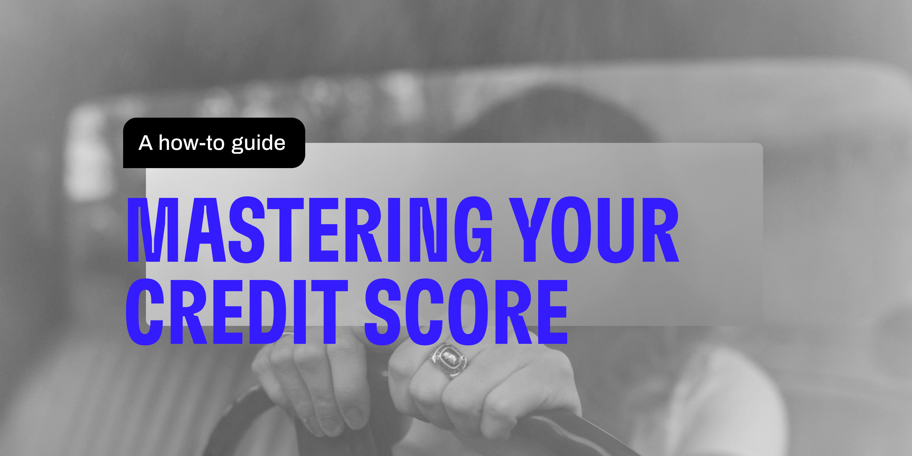 Black and white image of a woman driving a car with blue text showing "Mastering Your Credit Score: A How-To Guide." 