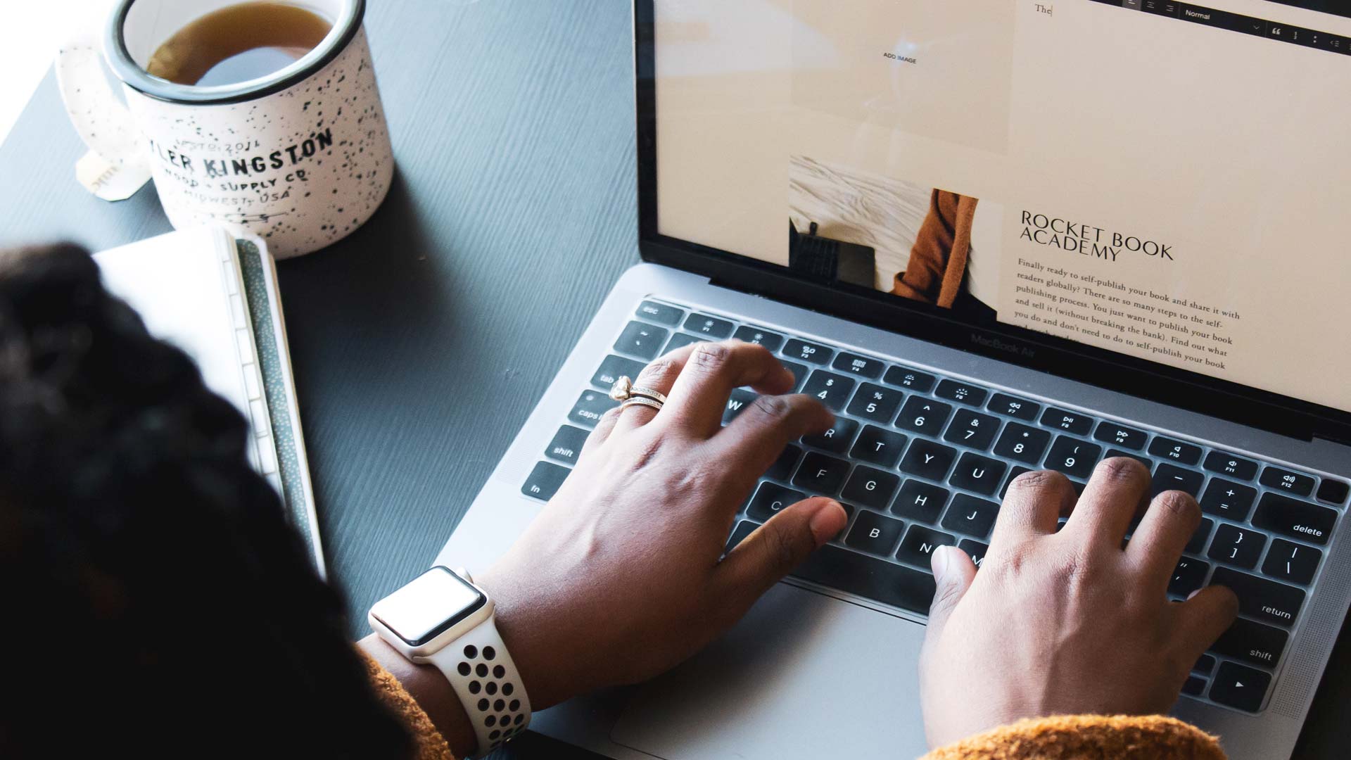 person working on computer doing squarespace website design