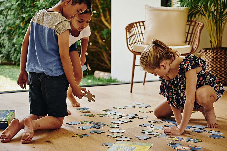 Early primary kids completing a STEM learning jigsaw puzzle