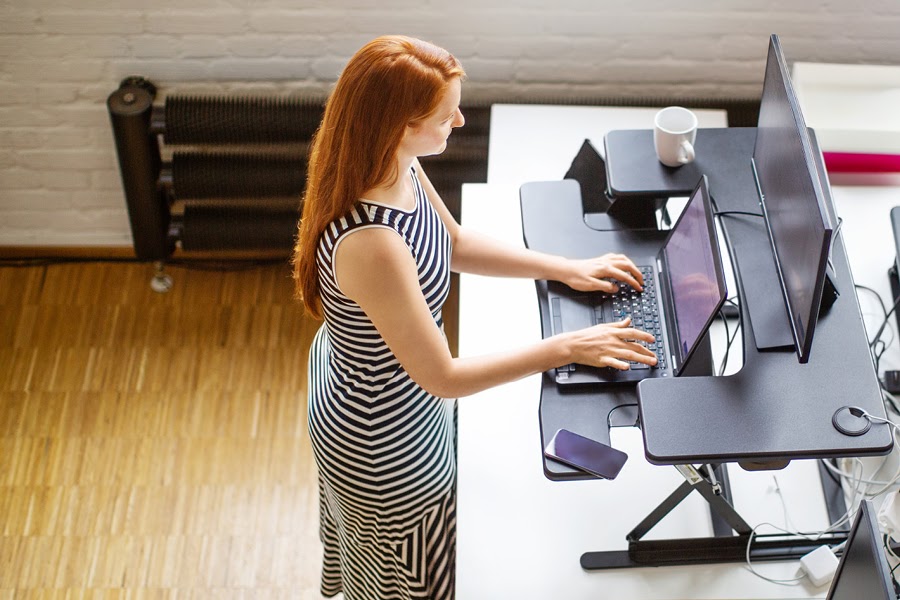 Switch between standing and sitting and take regular breaks.