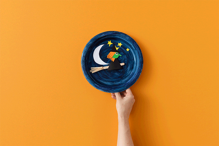 Create a cute paper witch on a broomstick in this easy Halloween craft project for kids.
