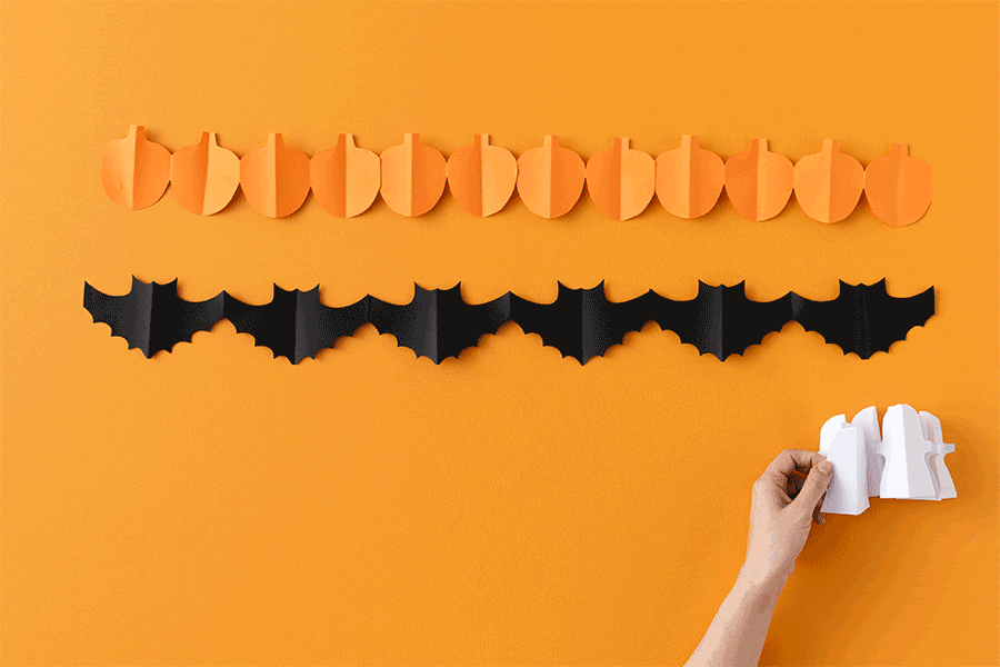 Spooky garlands made from paper are an easy and fun Halloween craft project for kids.
