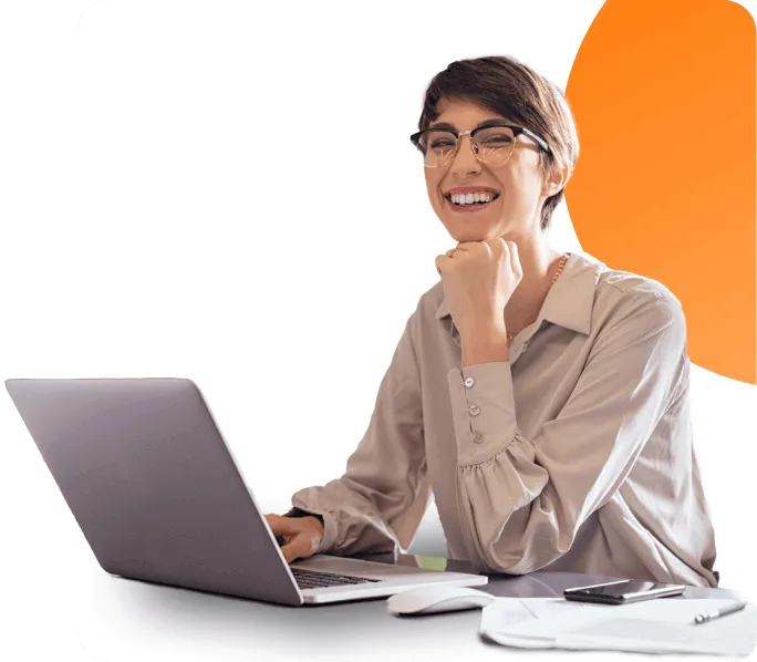 happy and engaged employee at workplace with her laptop