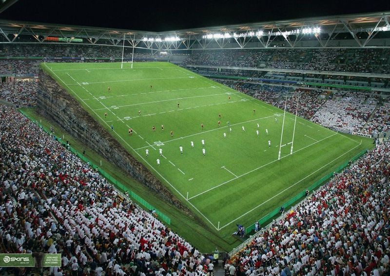 A soccer field that is lifted on one side to show an un-level playing field.