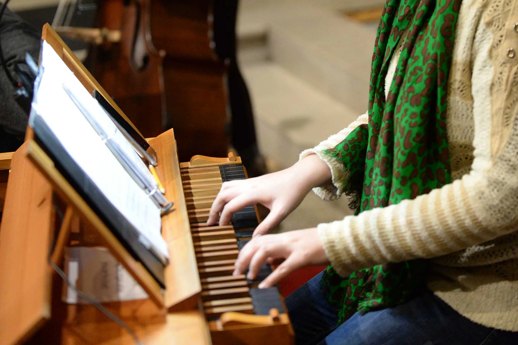 A closeup of hands playing the piano