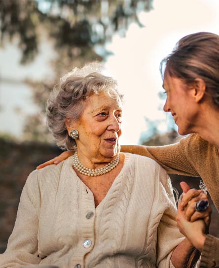 A happy mother and daughter talking to each other
