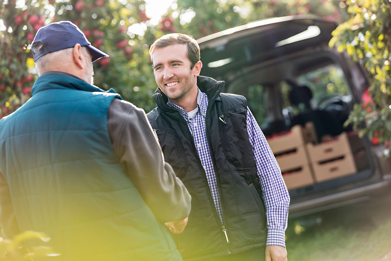 Farmer and client shaking hands