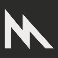 A white icon with an M for metal