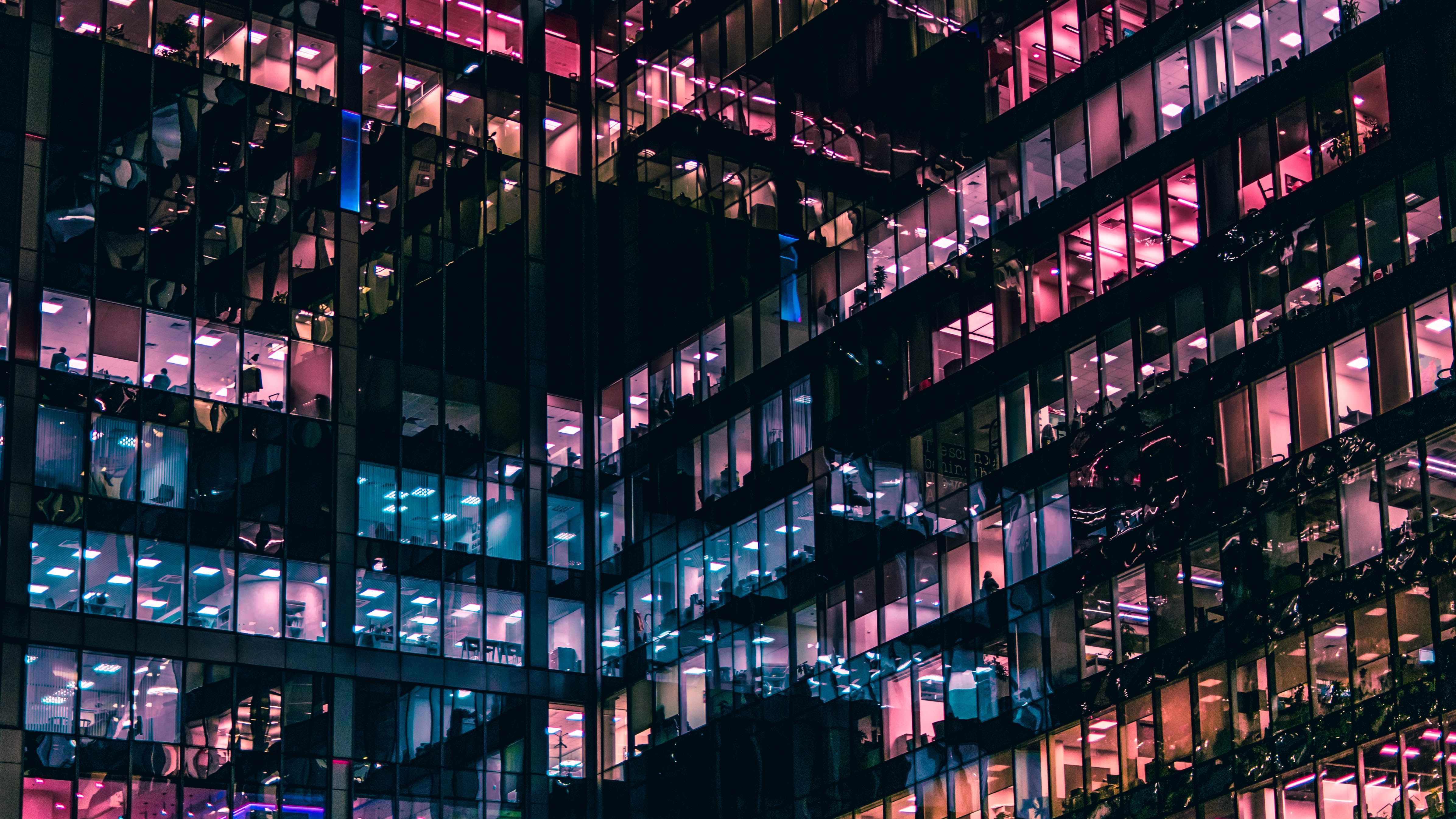 A building with glass on exterior influence society