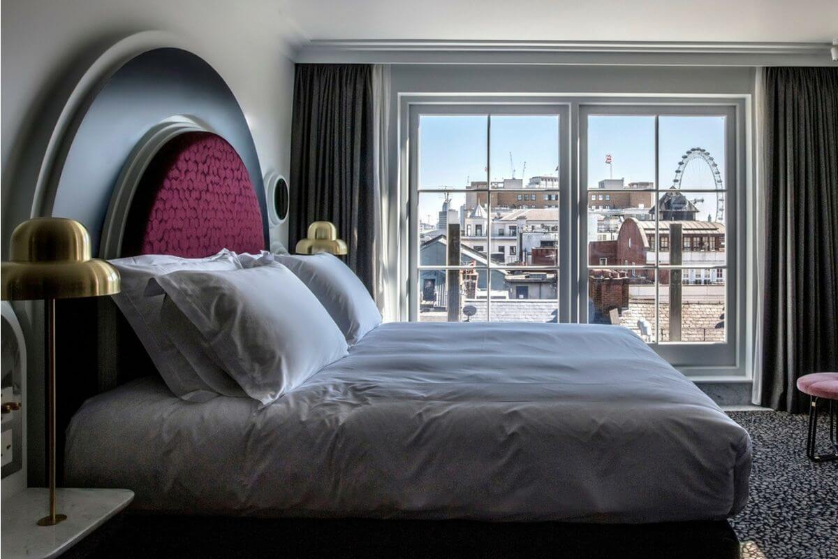 Bed with window view Henrietta Hotel Influence Society Hotel Digital Marketing Agency