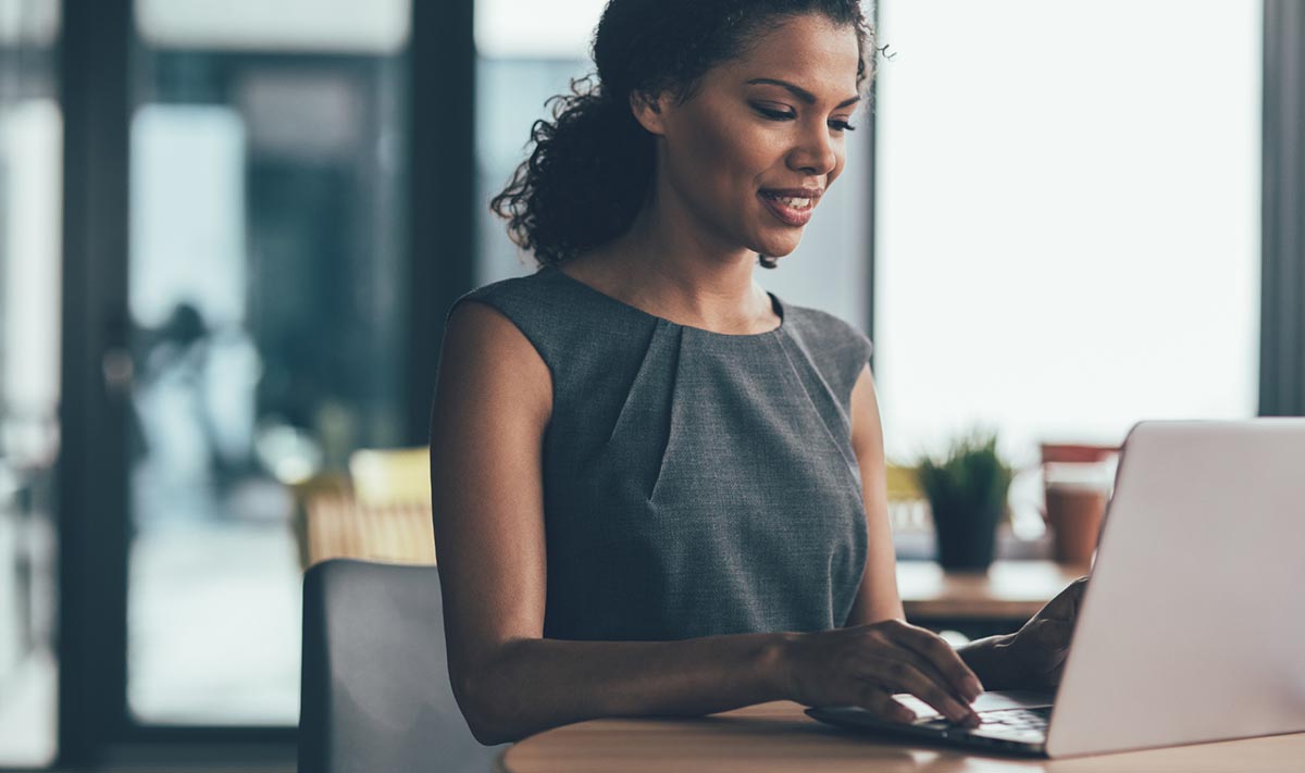 A woman works on a computer