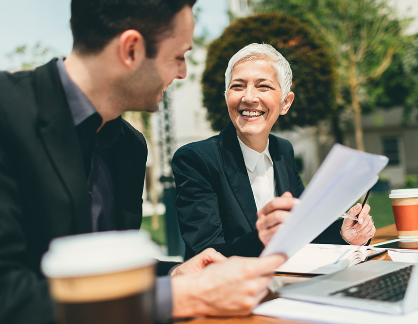 smiling woman holding paper