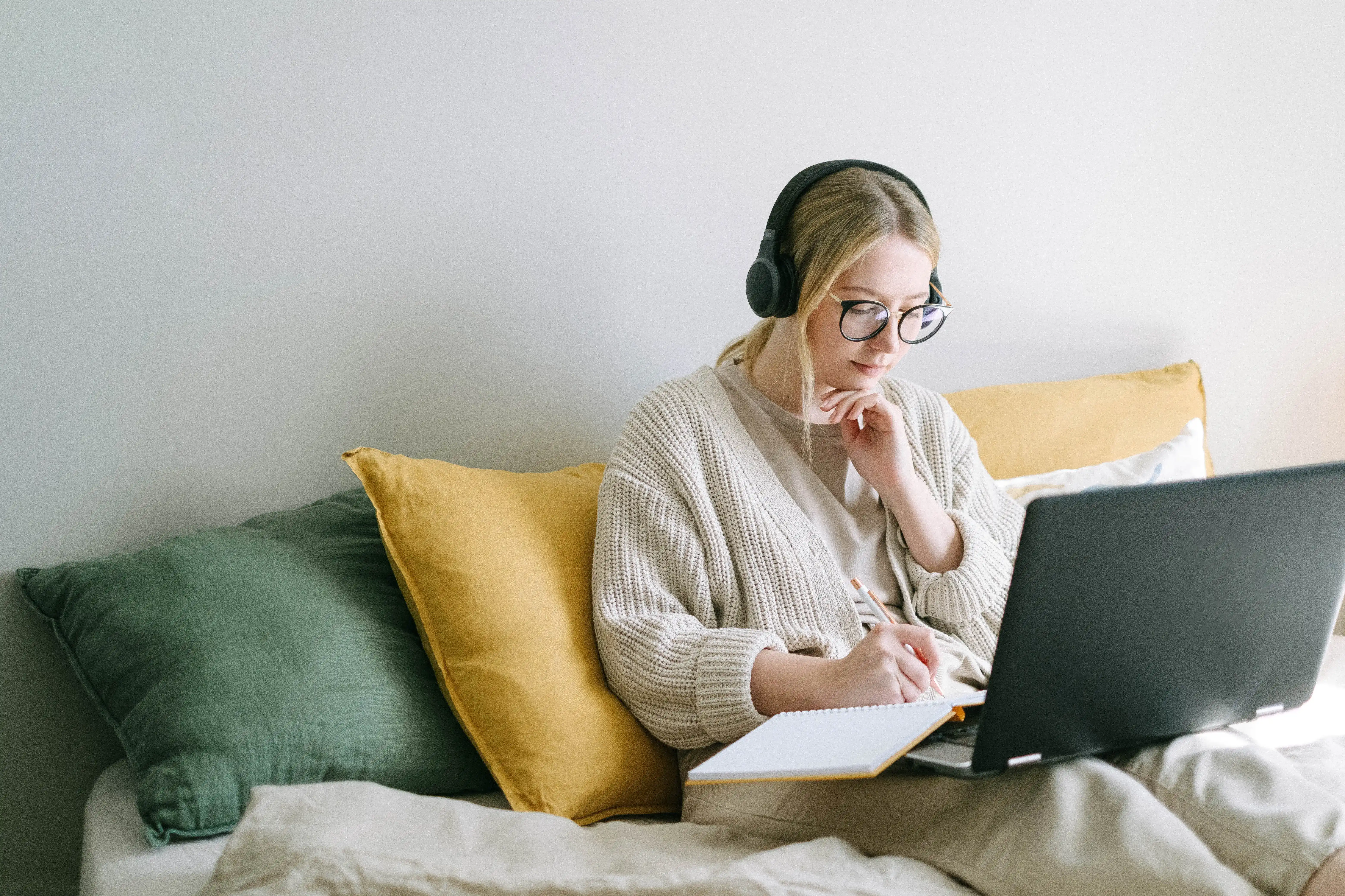 Woman taking notes on computer