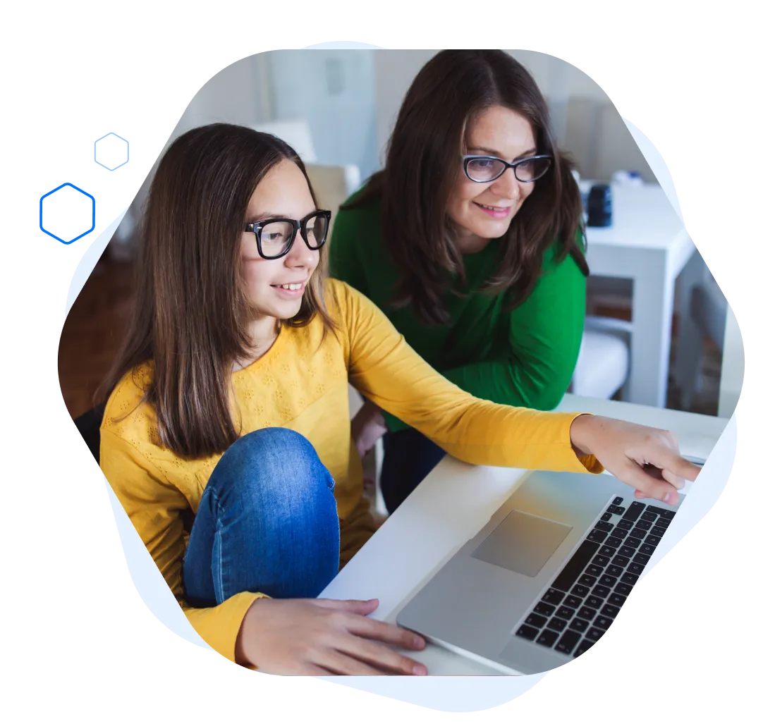 Two girls are sitting in the front of the lap top and smiling | Simple CLub