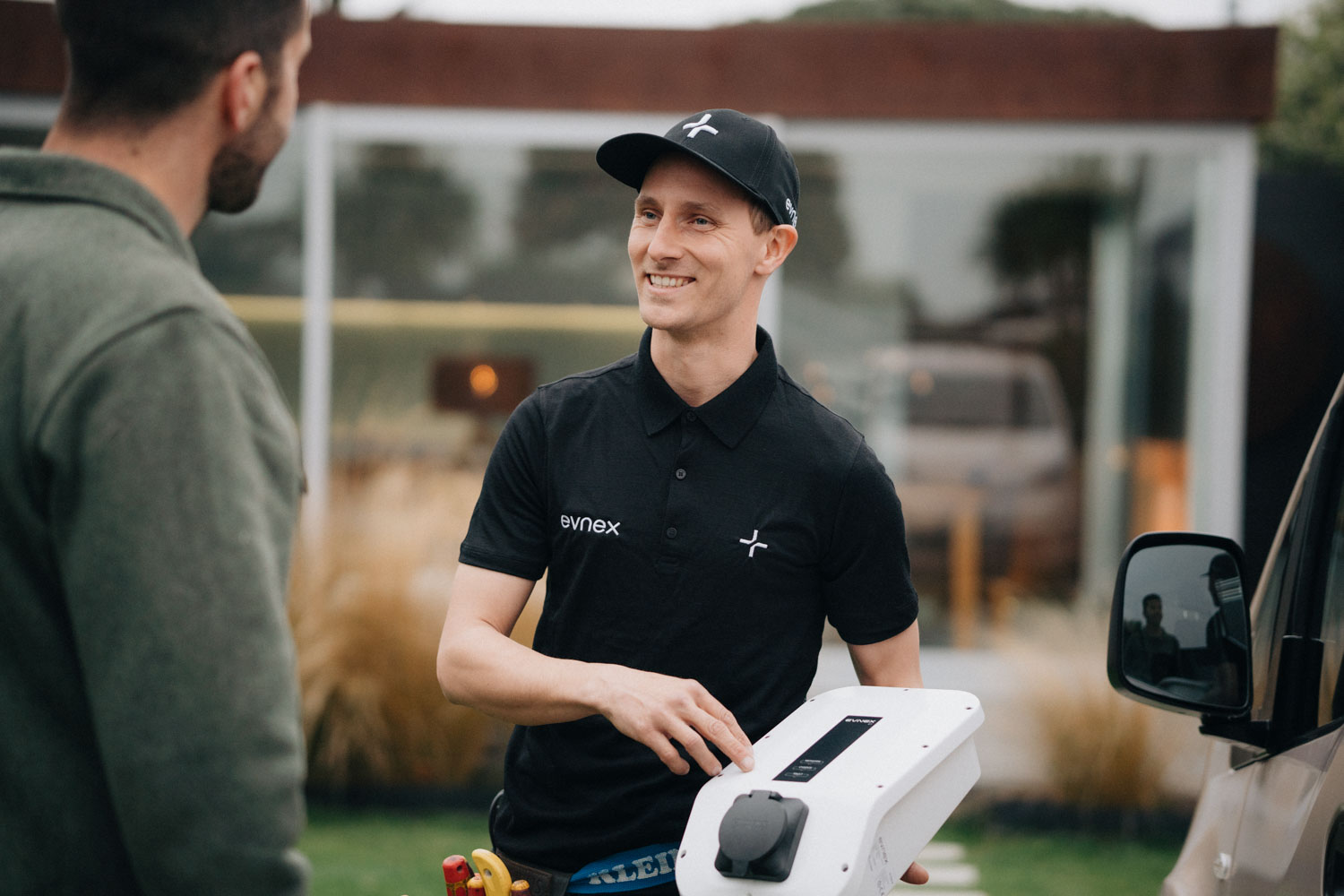 Showing EV charger installation to customer