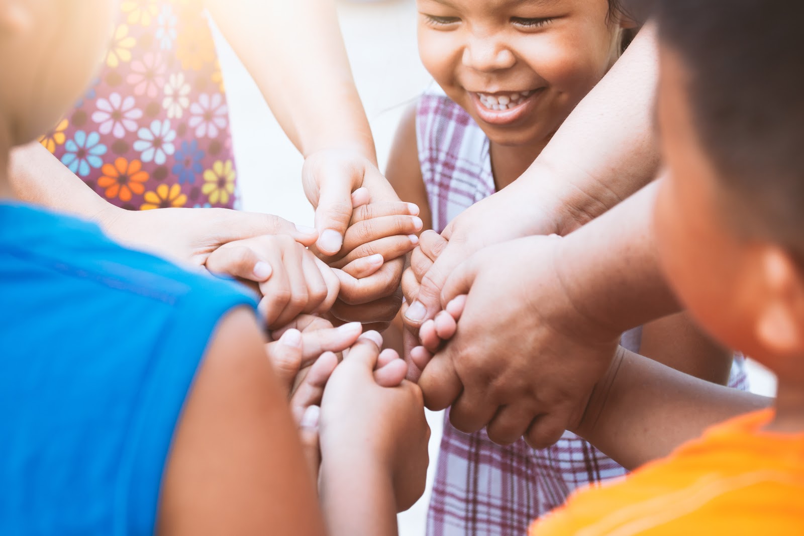 What is Giving Tuesday? Children laughing and holding hands