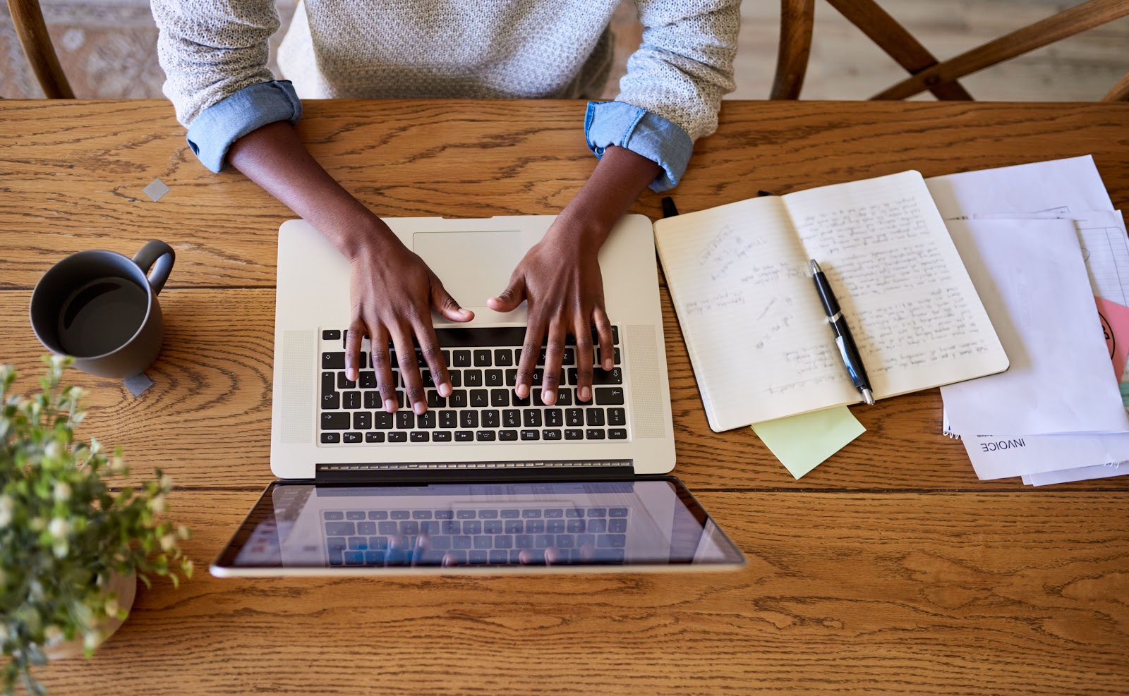 Donation request letter: Man's hands typing on laptop