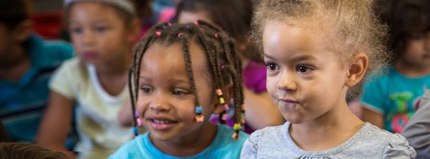 corporate philanthropy: Two female toddlers smiling