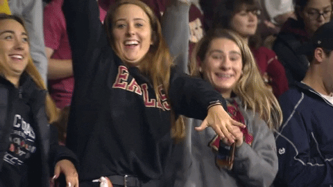 Football fundraising ideas: college girls cheering and dancing