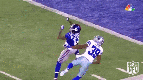 Football player catching the ball GIF
