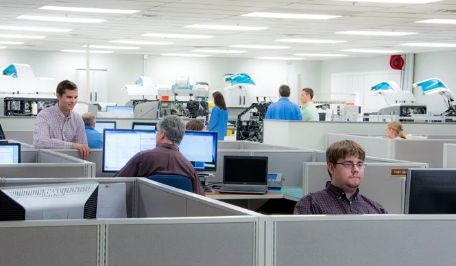Workers in the KMC Engineering lab.
